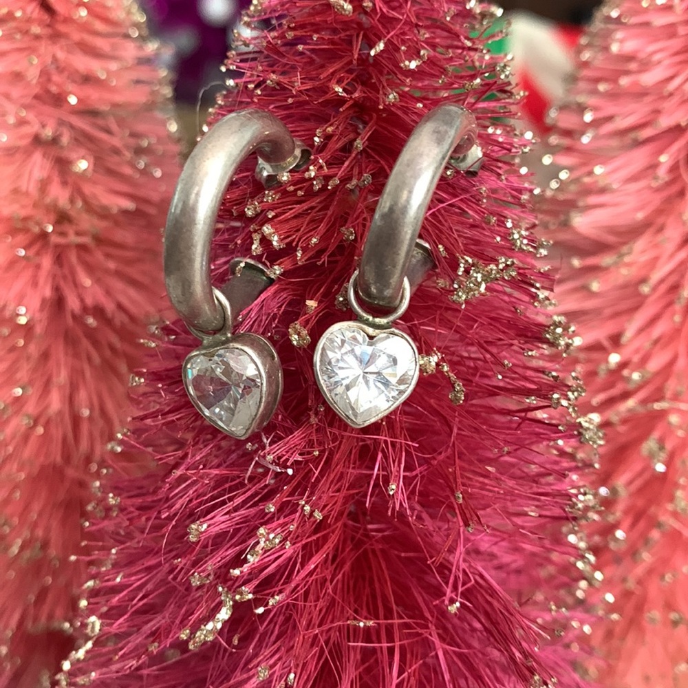 Sterling silver hoop earrings with heart pendants
